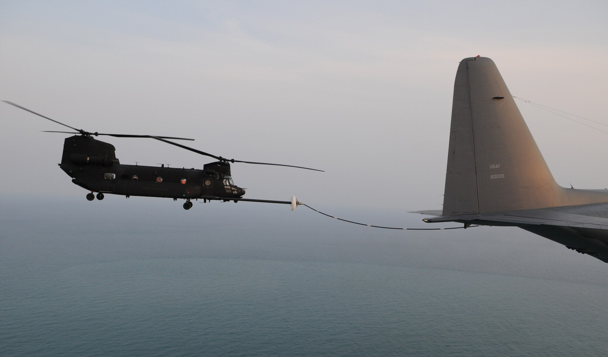 OVER THE REPUBLIC OF KOREA -- A U.S. Army MH-47 helicopter from the 160th Special Operations Aviation Regiment (Airborne) connects to a drogue refueling pod from a 17th Special Operations Squadron MC-130P Combat Shadow during a refueling training mission here March 30 during Foal Eagle 2009.  Foal Eagle is an annual combined training exercise for U.S. and Republic of Korea forces to evaluate and improve their ability to coordinate procedures, plans and systems necessary to defend the ROK. The 17th SOS is deployed from Kadena Air Base, Japan, and the 160th SOAR is deployed from Fort Lewis, Wash. (U.S. Air Force photo by Tech. Sgt. Aaron Cram)