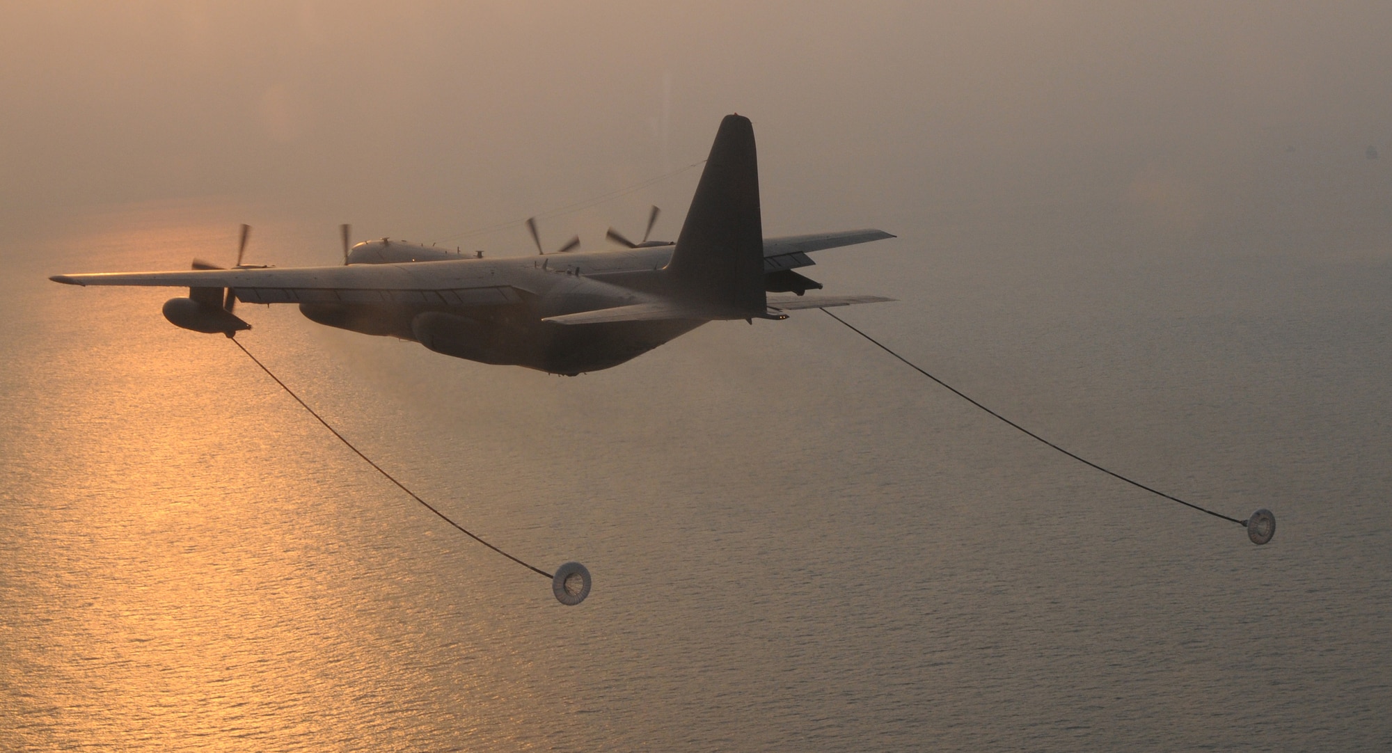 OVER THE REPUBLIC OF KOREA -- A MC-130P Combat Shadow from the 17th Special Operations Squadron releases its hoses and drogue refueling pods to refuel a U.S. Army MH-47 helicopter from the 160th Special Operations Aviation Regiment (Airborne) during a training mission here March 30 during Foal Eagle 2009.  Foal Eagle is an annual combined training exercise for U.S. and Republic of Korea forces to evaluate and improve their ability to coordinate procedures, plans and systems necessary to defend the ROK. The 17th SOS is deployed from Kadena Air Base, Japan, and the 160th SOAR is deployed from Fort Lewis, Wash. (U.S. Air Force photo by Tech. Sgt. Aaron Cram)