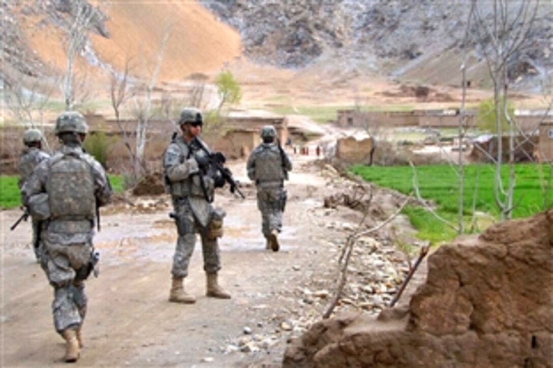 U.S. Army soldiers patrol a road to find potential ways to connect it to other villages in the Kapisa province, Afghanistan, March 28, 2009. The soldiers are assigned to the 1st Battalion, 178th Infantry Regiment.