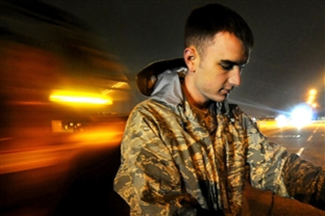 U.S. Air Force Senior Airman Steven Tawney secures a load of liquid nitrogen on a flat-bed trailer during Phase I of Exercise Beverly Morning on Yokota Air Base, Japan, March 31, 2009.
Tawney is assigned to the 374th Logistics Readiness Squadron.