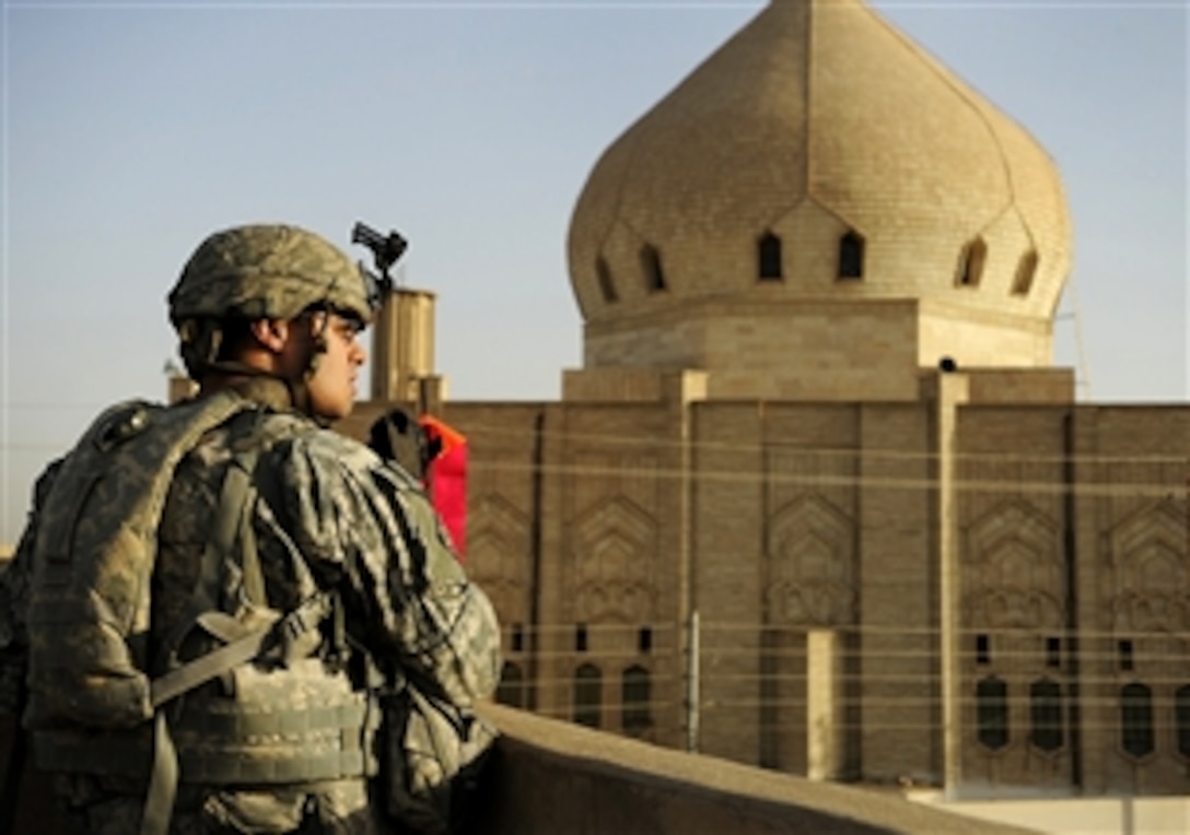 U.S. Army Spc. Karl White provides security on a rooftop for Iraqi soldiers conducting a cordon and knock mission in the Palestine neighborhood of Mosul, Iraq, March 23, 2009. White is assigned to Company B, 1st Battalion, 67th Armored Regiment.
