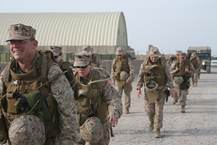 Sailors in the Fleet Marine Force Qualified Officers Program, participate in a six-mile hike aboard Camp Al Taqaddum, Iraq, April 2, 2009. The hike is one of several events required to earn the Fleet Marine Force Qualified Officers Pin.  (U.S. Marine Corps photograph by Cpl. Bobbie A. Curtis)