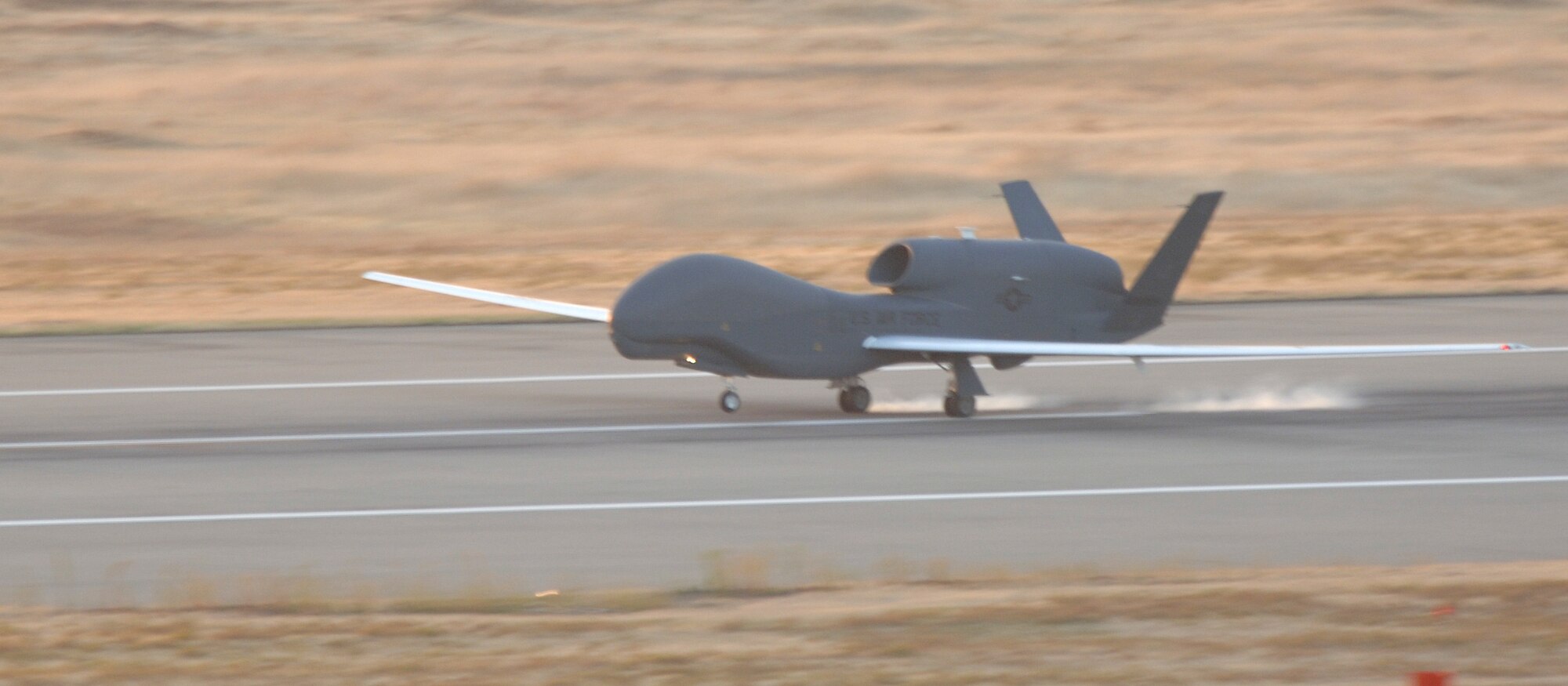 An RQ-4 Global Hawk lands at Beale Air Force Base, Calif., after completing a sortie. The unmanned aircraft recently surpassed the 30,000 flying hour milestone. (Photo by John Schwab)