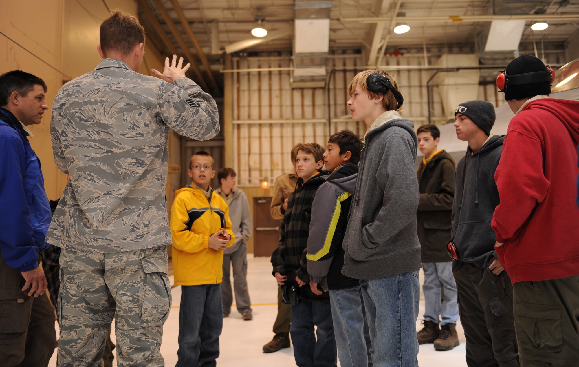 Staff Sgt. Matthew St John, 49th Maintenance Operations Squadron, briefs Boy Scout Troop 174, based out of Albuquerque, N.M., on the F-22A Raptor's capabilities during an F-22A Familiarization Course March 27 at Holloman Air Force Base, N.M. The troop stopped at Holloman for a day during their trip and surrounding areas such as White Sands National Monument. 