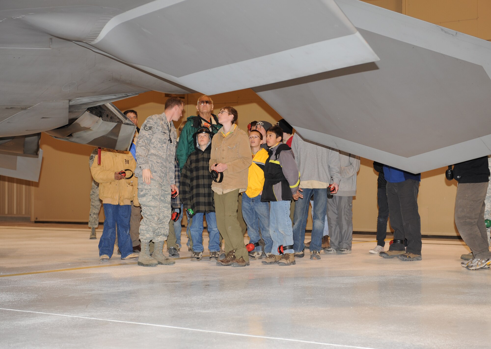 Staff Sgt. Matthew St John, 49th Maintenance Operations Squadron, briefs Boy Scout Troop 174, based out of Albuquerque, N.M., on the F-22A Raptor's capabilities during an F-22A Familiarization Course March 27 at Holloman Air Force Base, N.M. The troop also stopped to see the High Speed Test Track during their visit to Holloman.