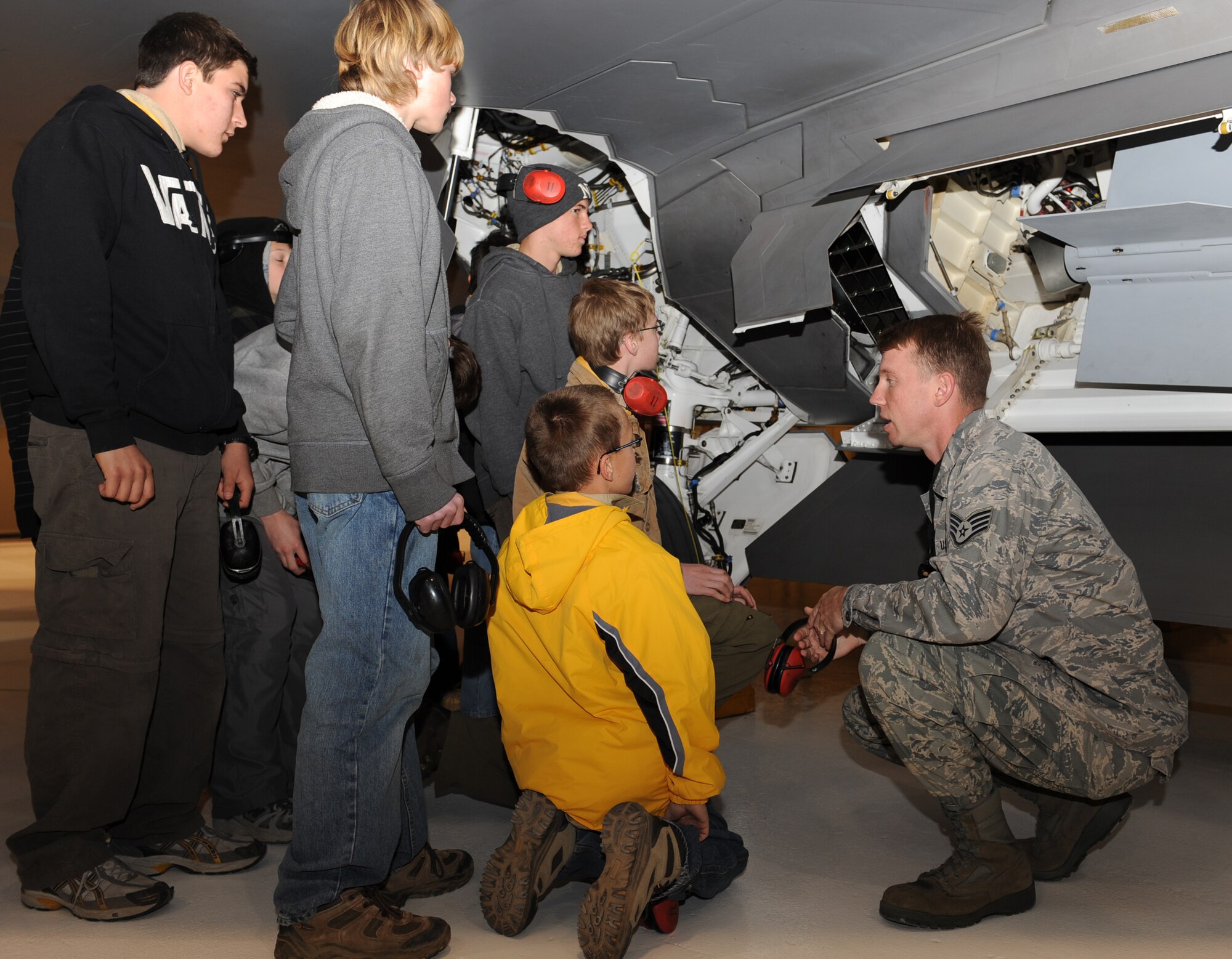 Staff Sgt. Matthew St John, 49th Maintenance Operations Squadron, briefs Boy Scout Troop 174, based out of Albuquerque, N.M., on the F-22A Raptor's capabilities during an F-22A Familiarization Course March 27 at Holloman Air Force Base, N.M. The troop was on their spring break trip.