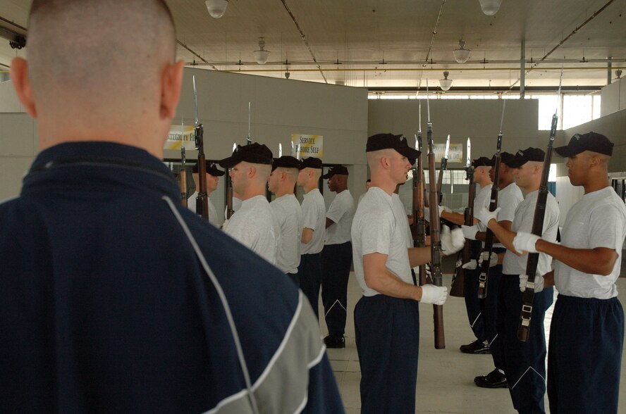 Capt. Brent Mundie, United States Air Force Honor Guard Drill Team commander, stands on his mark during a practice run of the Drill Team’s new performance March 30 at Maxwell Air Force Base, Ala. The traveling component of the Air Force Honor Guard, the drill team serves as Air Force ambassadors to recruit, retain and inspire Airmen around the globe. (U.S. Air Force photo by Senior Airman R. Michael Longoria)