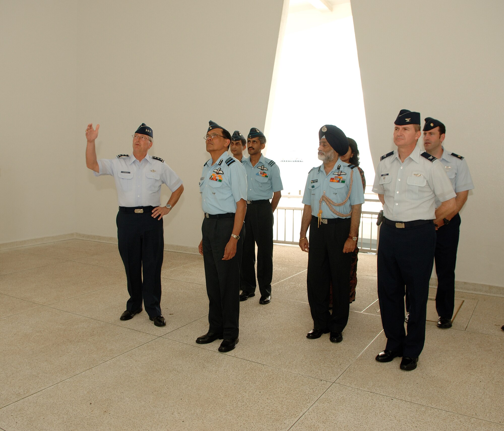 Lt. Gen. Chip Utterback, 13th Air Force commander, leads a tour of the USS Arizona Memorial at Pearl Harbor, Hawaii, March 26, for Air Marshal Dinesh Chandra Kumaria, director of general operations for the Indian Air Force. He and his team visited Hickam Air Force Base, Hawaii March 25- 29.  Senior military leaders from the Indian Air Force and the U.S. Air Force held an executive steering group meeting to discuss operational concepts and chart the way ahead for future training exchanges and exercises between both militaries. (U.S. Air Force Photo/ Vanessa Perez)
