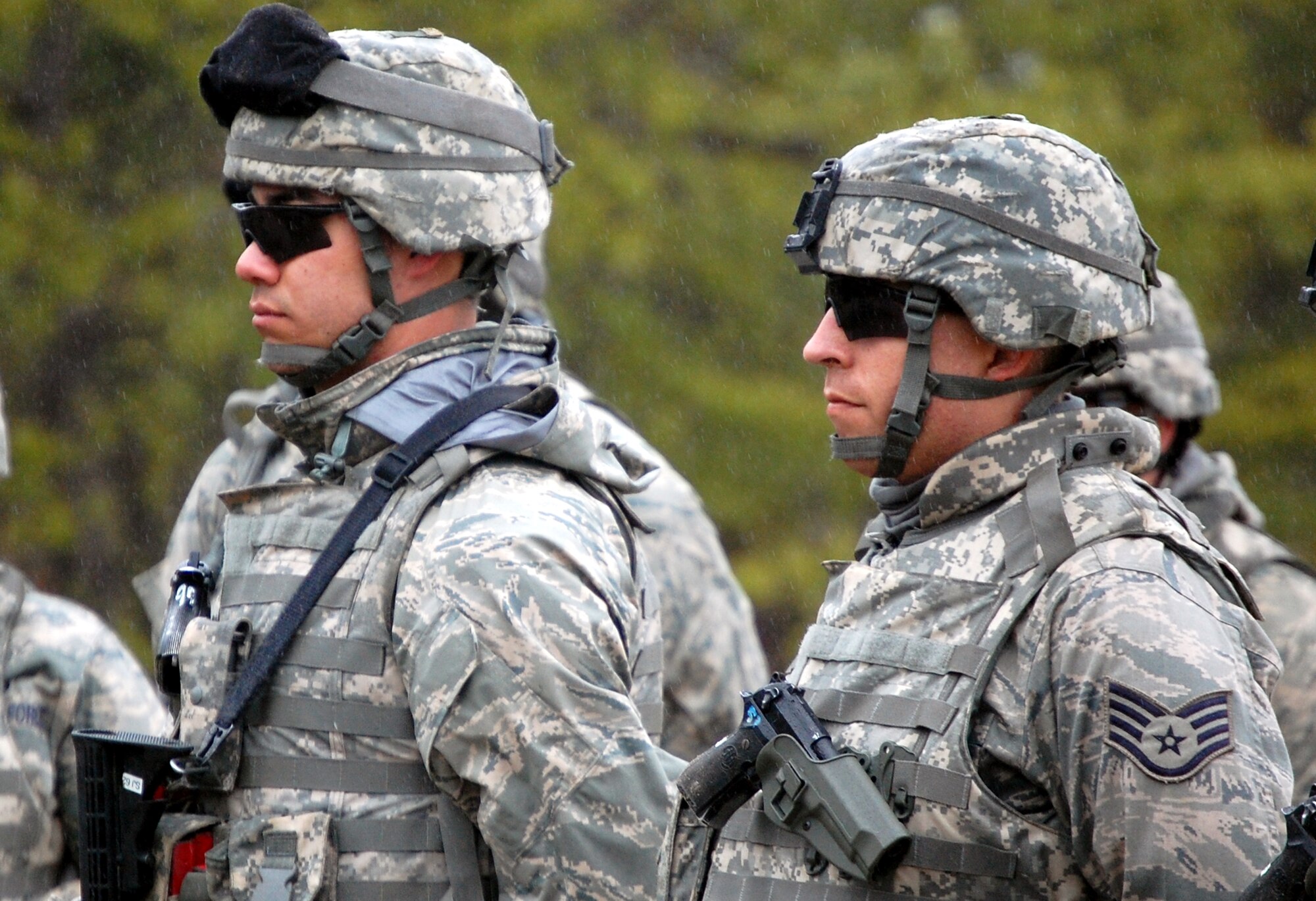 Security forces Airmen training for upcoming deployments listen to a briefing prior to participating in live-fire tactical shooting class on a Fort Dix, N.J., range on March 26, 2009.  The training was provided by the U.S. Air Force Expeditionary Center's 421st Combat Training Squadron.  (U.S. Air Force Photo/Tech. Sgt. Scott T. Sturkol)