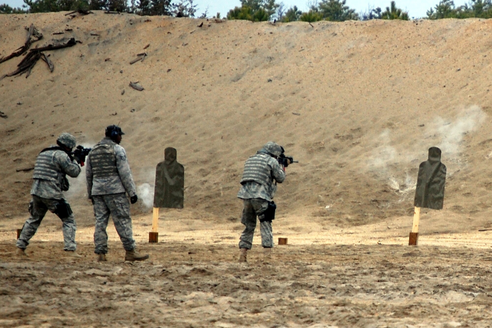 Security forces Airmen training for upcoming deployments parrticipate in live-fire tactical shooting on a Fort Dix, N.J., range on March 26, 2009.  The training was provided by the U.S. Air Force Expeditionary Center's 421st Combat Training Squadron.  (U.S. Air Force Photo/Tech. Sgt. Scott T. Sturkol)