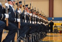 An audience at the Maxwell gym March 31 witnessed a first for the Air Force Honor Guard Drill Team as they performed high precision drills to a rock sound provided by Max Impact, an ensemble from the Air Force Band at Bolling Air Force Base, D.C.  Also from Bolling AFB, the drill team has been at Maxwell for the past month perfecting their routines for the upcoming performance season. (Air Force photo by Jamie Pitcher)