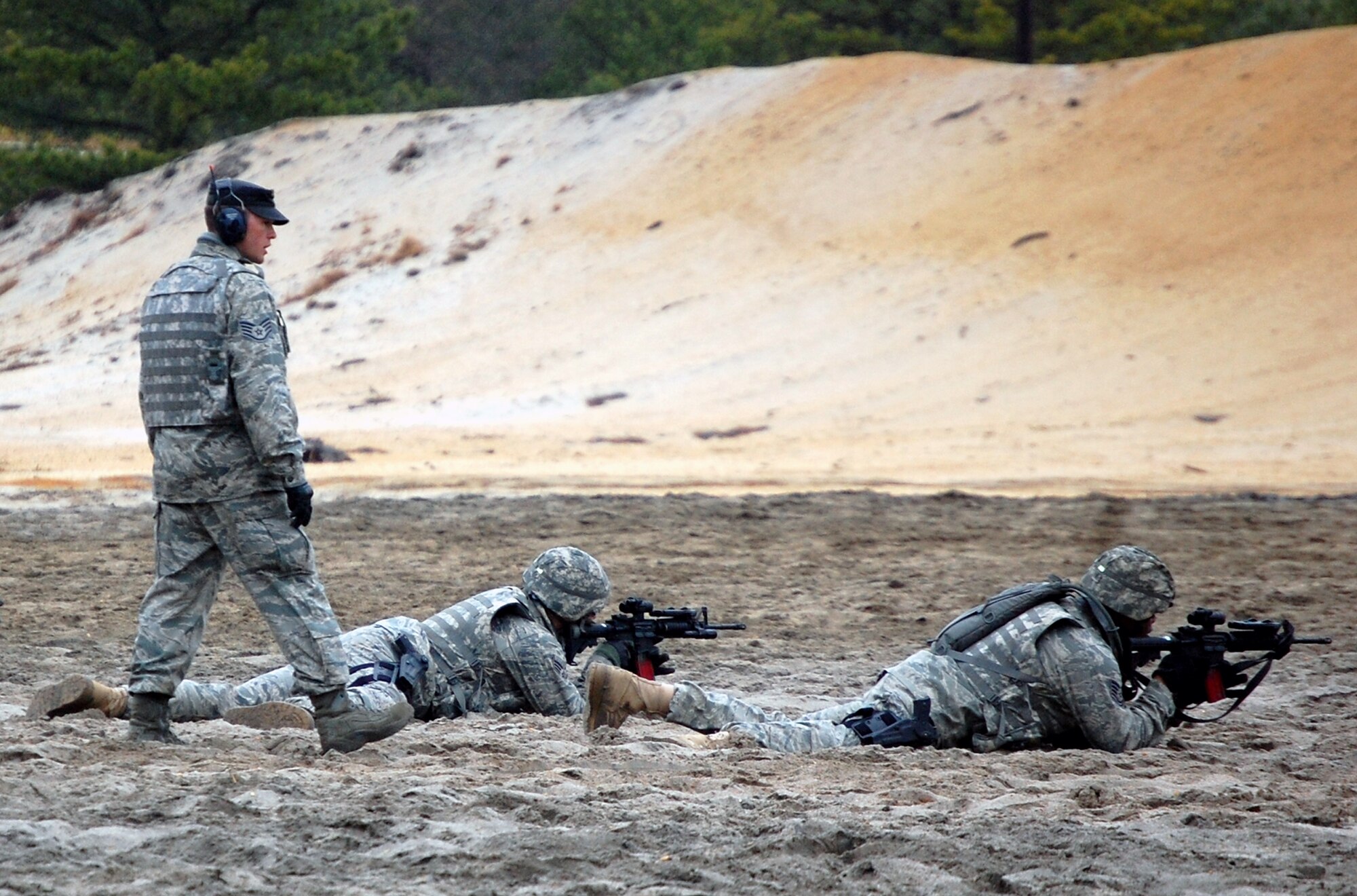 Security forces Airmen training for upcoming deployments parrticipate in live-fire tactical shooting on a Fort Dix, N.J., range on March 26, 2009.  The training was provided by the U.S. Air Force Expeditionary Center's 421st Combat Training Squadron.  (U.S. Air Force Photo/Tech. Sgt. Scott T. Sturkol)