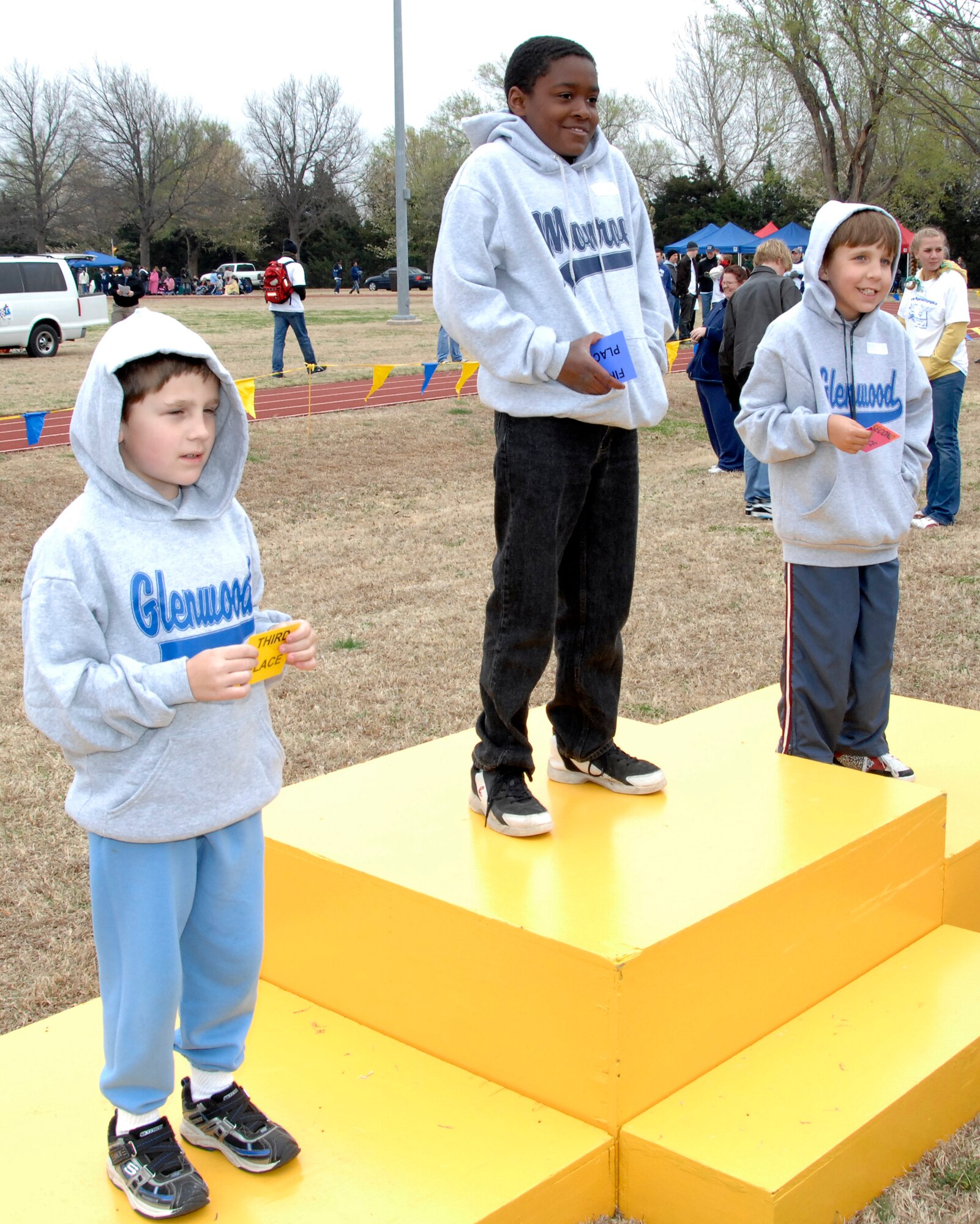 Special Olympians stand on the award podium awaiting their ribbons during competition at the 2009 Cherokee Strip Area 6 Track and Field Athletics meet held at Vance March 26. More than 250 Vance Airmen volunteered to assist 225 athletes compete in 13 events. In the 40-year history of the Area 6 Special Olympics, 20 of the competitions have been held at Vance. (U.S. Air Force photo by Terry Wasson)