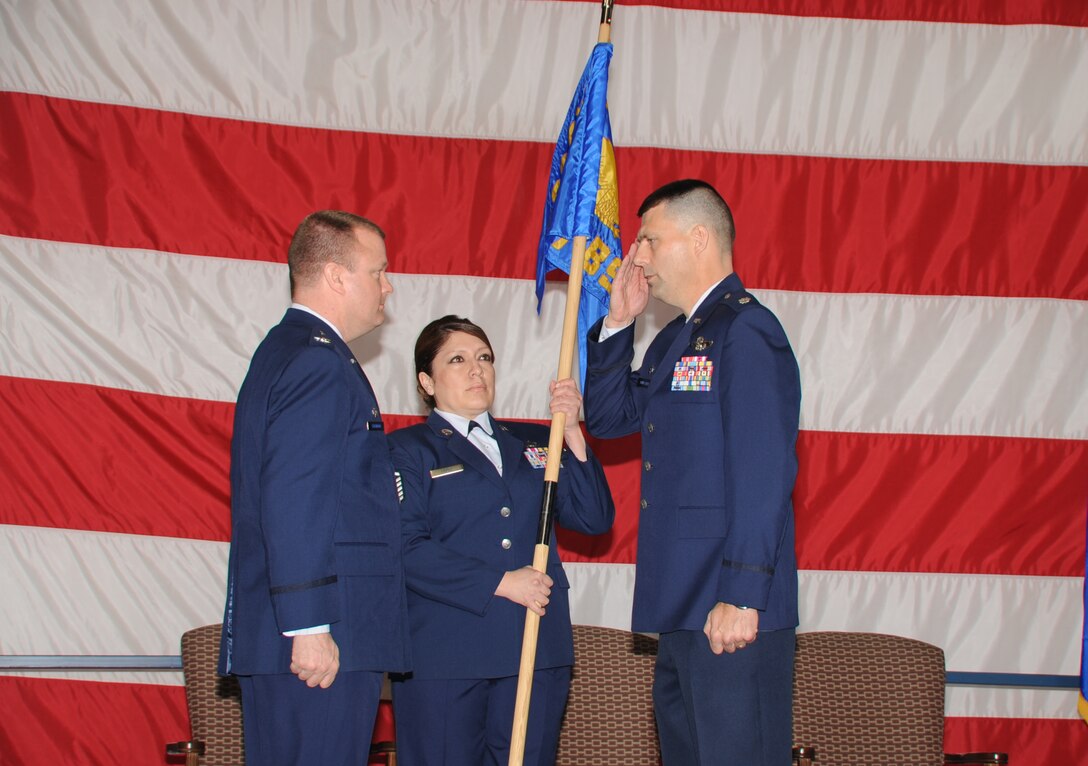 (Right to left) Lt. Col. Kirk Hunsaker, outgoing 37th Bomb Squadron commander, salutes Col. Buck Shawhan, 28th Operations Group commander, before relinquishing command of the 37 BS here, April 2.  Lt. Col. Steven Biggs took command of the 37th Bomb Squadron during the ceremony. (U.S. Air Force photo/Senior Airman Anthony Sanchelli)

