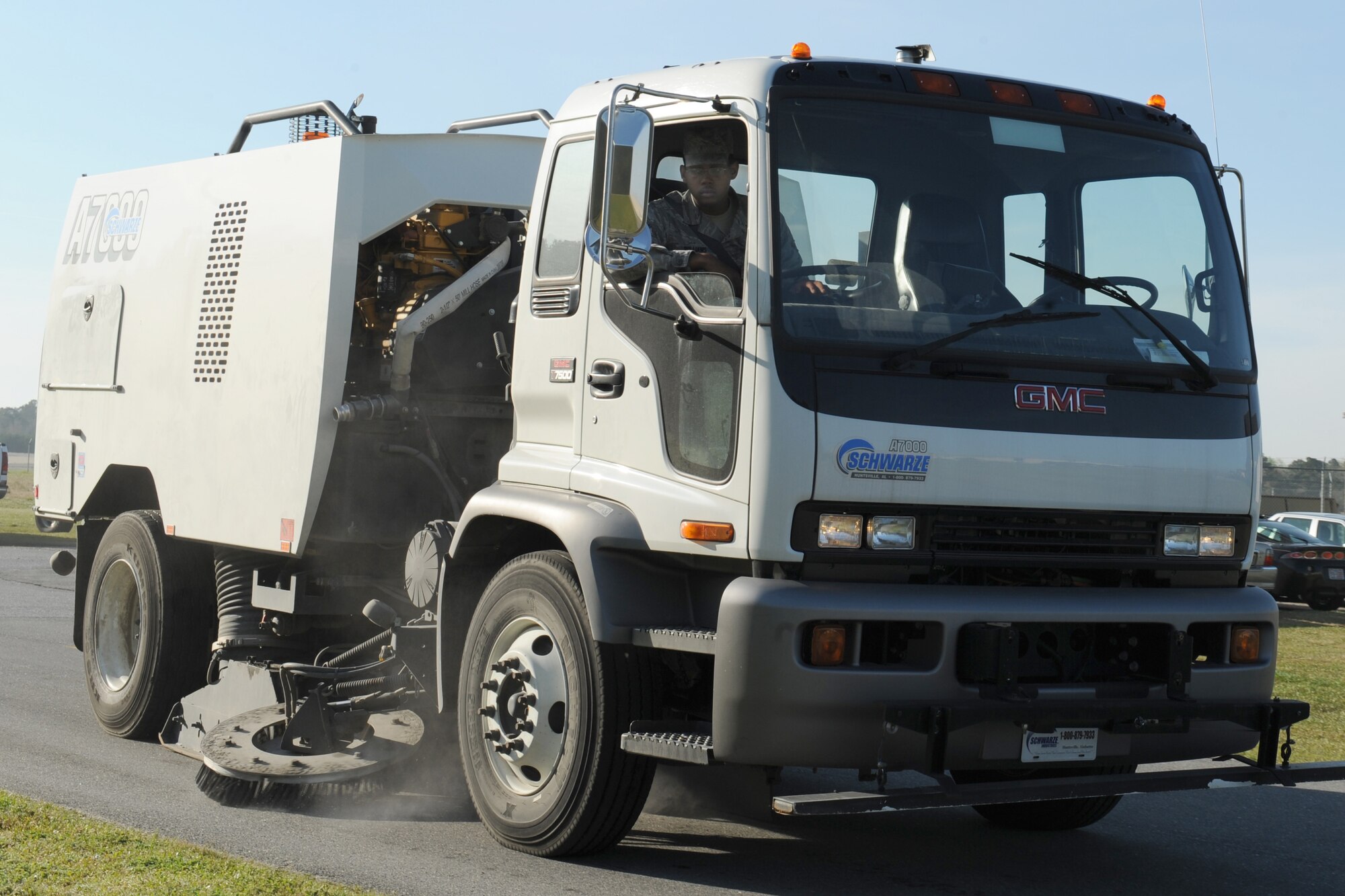 Airman Desmon L. Williams, 4th Civil Engineer Squadron, drives a street sweeper down Vermont Garrison Street on Seymour Johnson Air Force Base, N.C., March 31, 2009. The street sweepers are used to conduct base beautification and for safety. 4th CES Heavy Equipment members keep the base clean by conducting regular sweeps.  (U.S. Air Force photo by Airman 1st Class Whitney S. Lambert)  