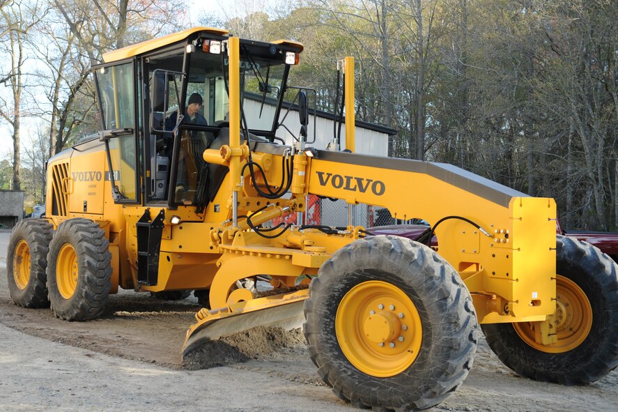 Staff Sgt. Owl'n Williams, 4th Civil Engineer Squadron, uses a grader to smooth out an uneven road on Seymour Johnson Air Force Base, N.C., March 31, 2009. Sergeant Williams repaired a pothole under the gravel which was causing a rough ride near the civil engineer readiness building. 4th CES Heavy Equipment Airmen conduct most of the road maintenance here. (U.S. Air Force photo by Airman 1st Class Whitney Lambert)  