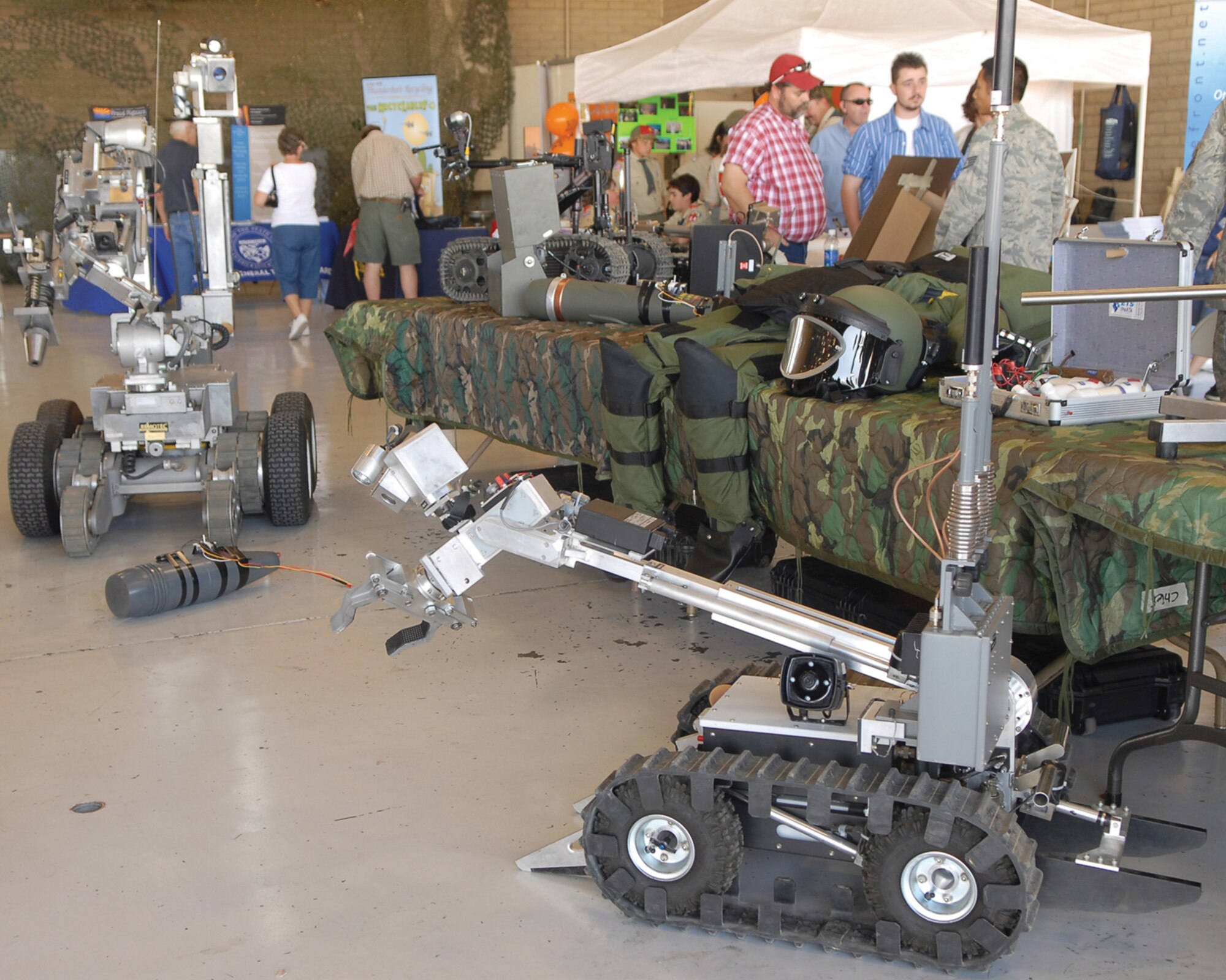 The 56th Civil Engineer Squadron’s Explosive Ordnance Disposal team displays EOD equipment at a booth inside Hangar 431 March 21 during the 2009 Luke Days Thunder in the Desert Open House and Air Show. (U.S. Air Force photo/Airman 1st Class Ronifel Yasay)