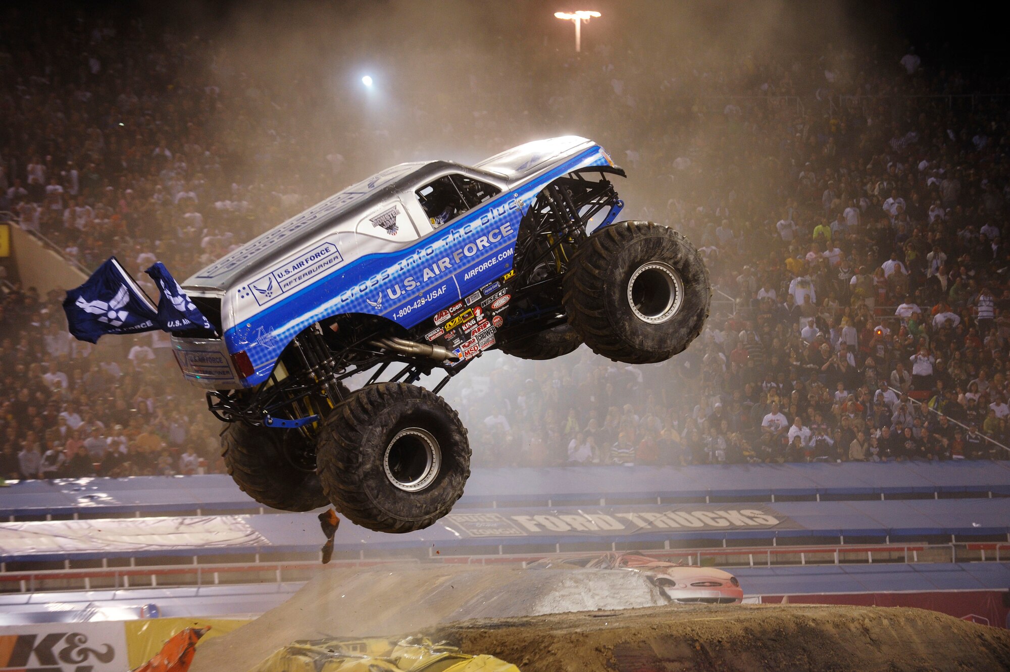 The Air Force Afterburner driven by Damon Bradshaw catapults over an obstacle March 28 on its way to best a field of 24 competitors and capture the freestyle championship at the 2009 Monster Jam World Finals at Sam Boyd Stadium in Las Vegas, Nev. Before a crowd of more than 40,000, Bradshaw scored a 36 to give the Air Force Afterburner its first championship. (Photo courtesy of Feld Entertainment)