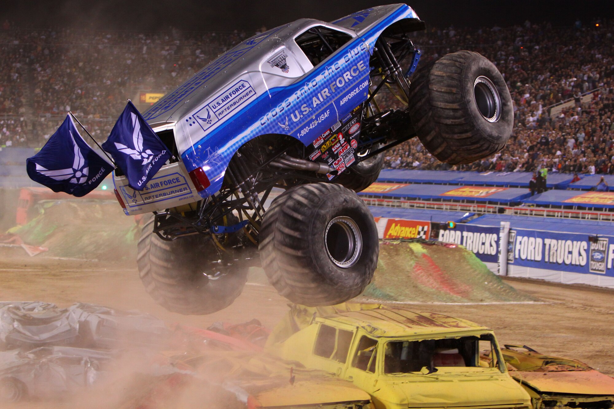 The Air Force Afterburner driven by Damon Bradshaw catapults over an obstacle March 28 on its way to best a field of 24 competitors and capture the freestyle championship at the 2009 Monster Jam World Finals at Sam Boyd Stadium in Las Vegas, Nev. Before a crowd of more than 40,000, Bradshaw scored a 36 to give the Air Force Afterburner its first championship. (Photo courtesy of Feld Entertainment)
