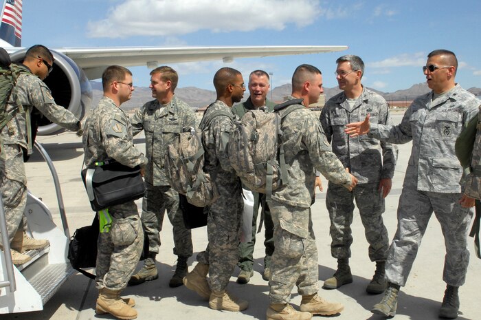 Nellis military leaders and commanders welcome home more than 130 Airmen assigned to the 99th Air Base Wing Security Forces Group as they return from combat duty in Iraq April 1.  The security forces Airmen arrive home from an eight-month deployment, which included serving on missions such as convoy security detail, installation security and patrol duty in Iraq.  (U.S Air Force photo by Staff Sgt. Taylor Worley) (Released)