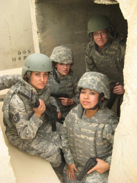 (From the left) Tech. Sgt. Chandra Smith, Capt. Darci Day, 1st Lt. Rhoda Alzo and Tech. Sgt. Bridgette Johnson sit in a Bagram Air Base bunker in Afghanistan. The Tops in Blue team members visited virtually every U.S. air base around the world. (Courtesy photo)