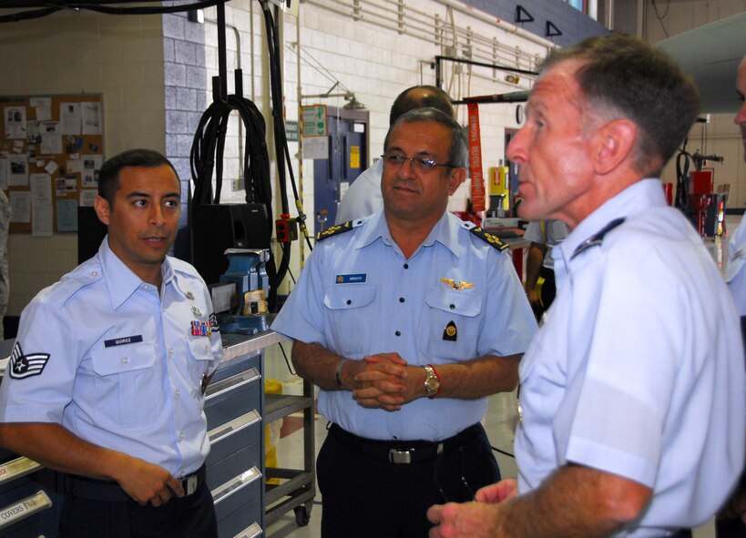 Lt. Gen. Norman Seip, right, the Twelfth Air Force (Air Forces Southern) commander, talks about F-16 phase maintenance with General Pedro Minaya Torres, Peruvian Air Force commanding general, in a 162nd Fighter Wing maintenance hangar at Tucson International Airport, April 1. Staff Sgt. Raul Quiroz, an aircraft maintainer at the Air Guard unit and a native of Peru, translates the conversation. Twelfth Air Force introduced General Minaya to the 162nd for its international pilot training  mission. "I'm inspired by all the United States has done for its allies and I hope Peruvian Air Force pilots will one day train with U.S. pilots," said General Minaya. (Air
National Guard photo by Master Sgt. Dave Neve)
