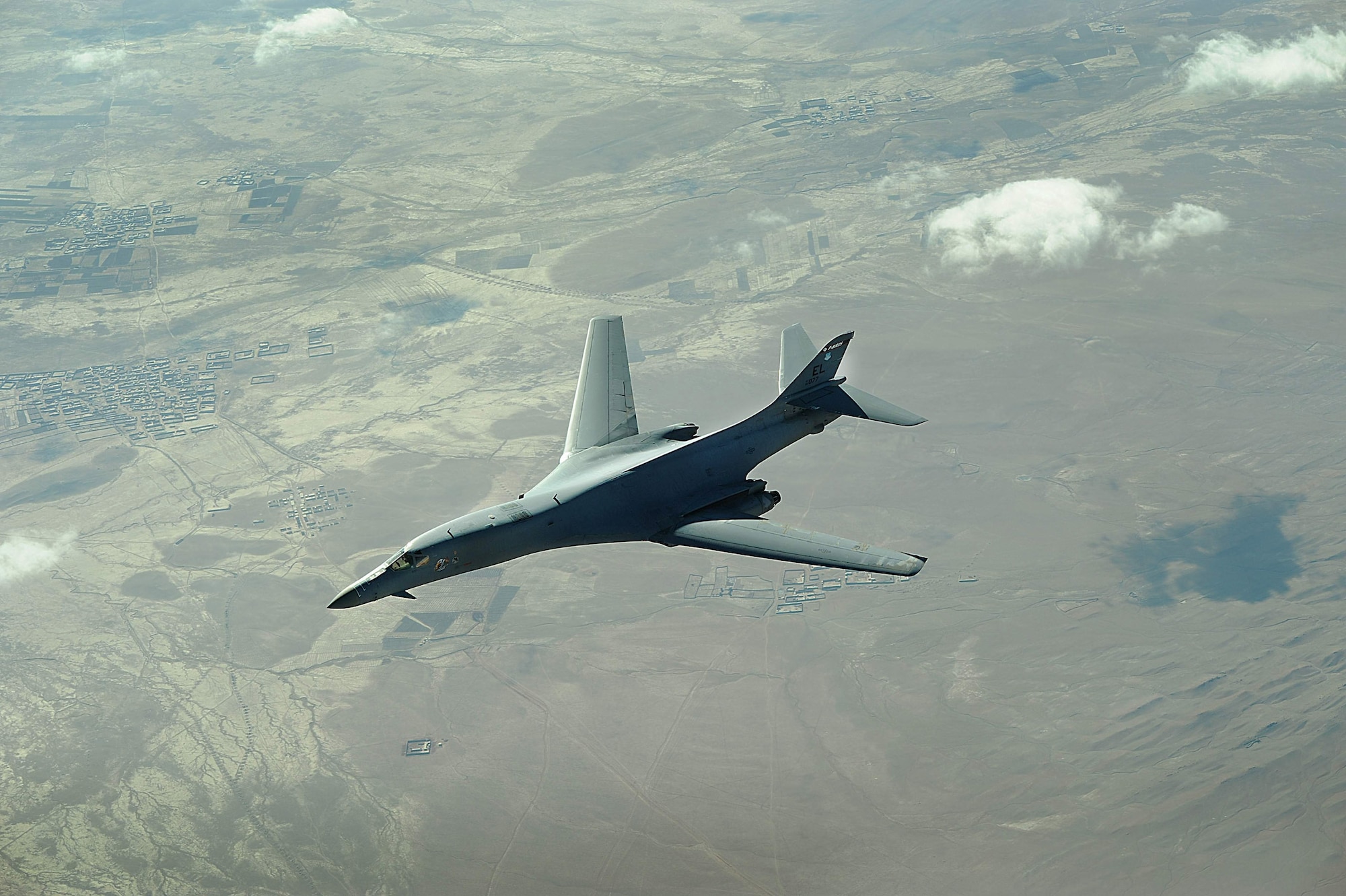 An Air Force B-1B Lancer flies a mission over Afghanistan. The B-1B can rapidly deliver massive quantities of precision and non-precision weapons against any adversary, anywhere in the world, at any time. (U.S. Air Force photo) 