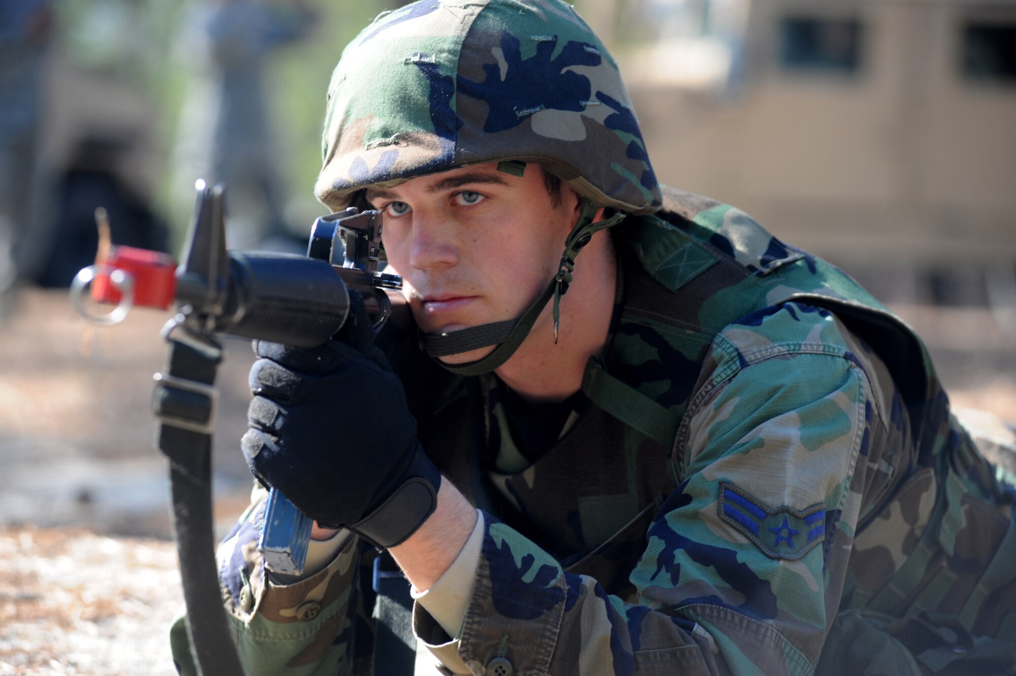 An Airman provides security for his fellow Airmen during convoy operations training on a Fort Dix, N.J. range, March 31, 2009.  The students are in a U.S. Air Force Expeditionary Center's Advanced Contingency Skills Training Course taught by the 421st Combat Training Squadron which prepares Airmen for upcoming deployments with advanced combat skills.   (U.S. Air Force Photo/Staff Sgt. Nathan G. Bevier) 