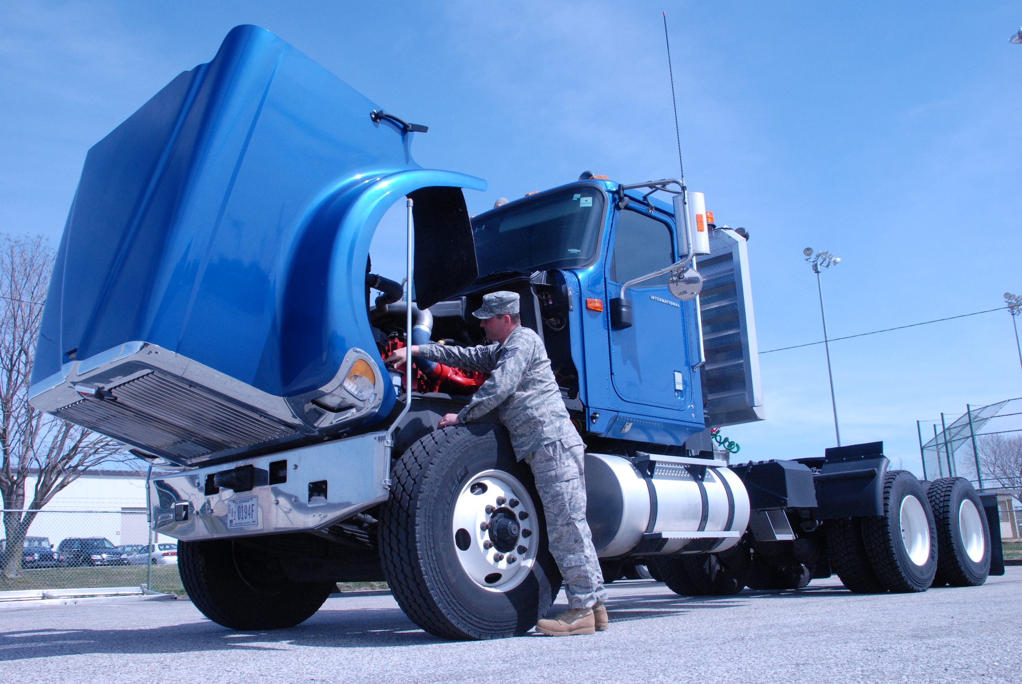 Tech. Sgt. Jamie Hall, 436th Logistics Readiness Squadron NCO in charge, training and validation office, inspects Dover?s current 10-ton tractor truck. The base will be receiving and testing a new heavy-duty hybrid electric tractor truck near the beginning of May. The test is to determine if the new tractor will conserve more diesel fuel than a regular tractor truck, potentially conserving energy and saving money for the Air Force. (U.S. Air Force photo/Airman 1st Class Shen-Chia Chu) 