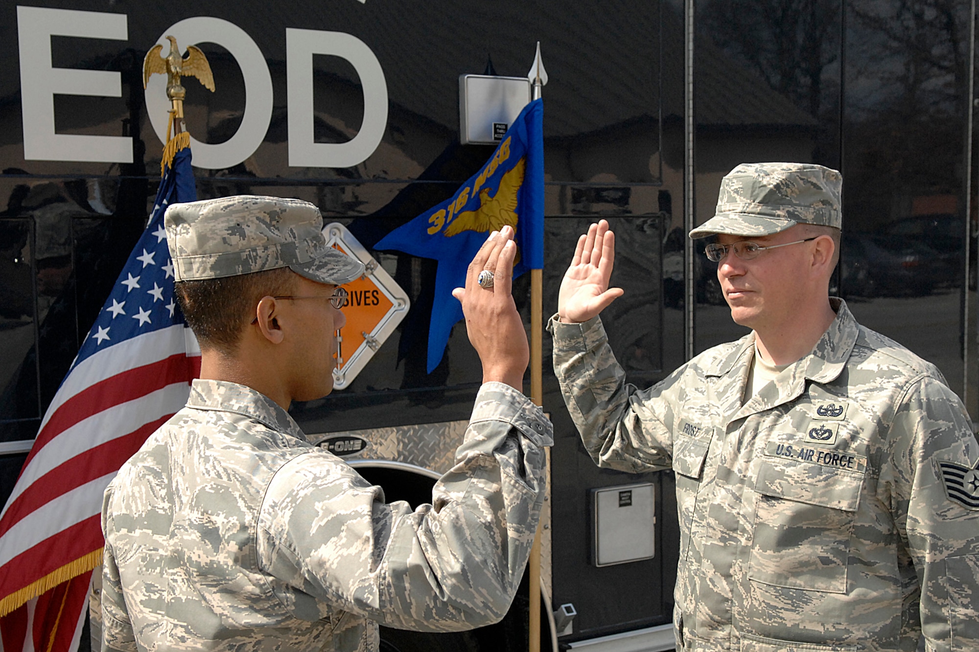 Lieutenant Col. Michael Saunders, 316th Civil Engineer Squadron commander, reenlists Technical Sergeant Christopher Frost, 316 CES non commissioned officer in charge of Explosive Ordnance Disposal flight on March 20. This is a time honored ceremony where the men and women of America’s Armed Forces pledge to continue service to defend the nation. (U.S. Air Force photo by Senior Airman Giang Nguyen)