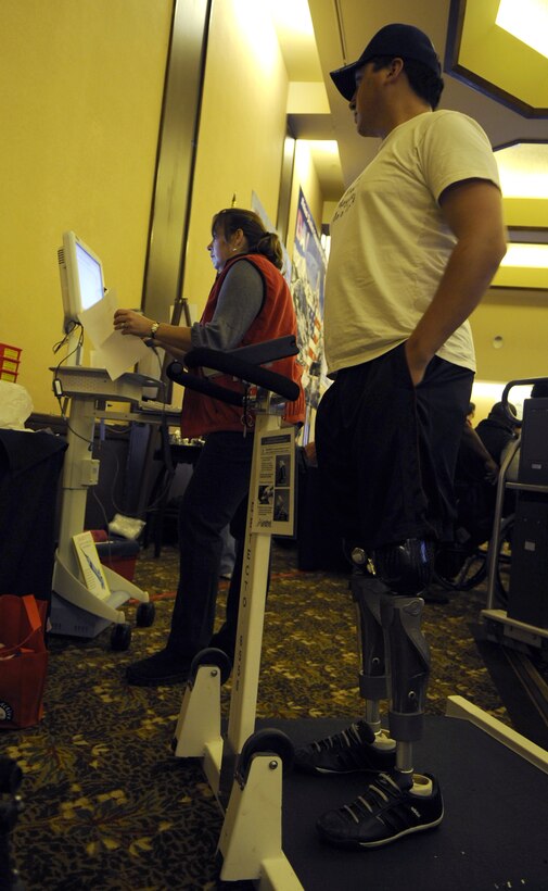 U.S. Air Force Senior Airman Kevin Krogh gets weighed inside the Silver Tree Hotel, March 29, 2009, during registration for the 23rd National Disabled American Veterans Winter Sports Clinic in Snowmass Village, Colo. 
