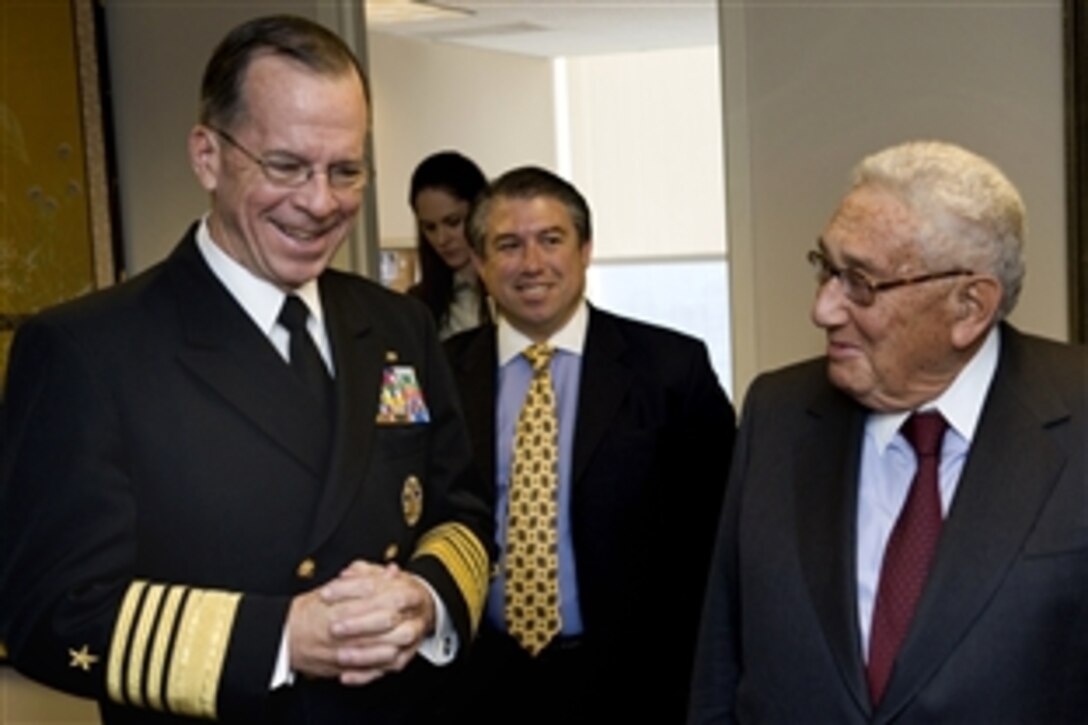U.S. Navy Adm. Mike Mullen, chairman of the Joint Chiefs of Staff, left, meets former Secretary of State Dr. Henry Kissinger during a visit to his office in New York City, April 2, 2009.