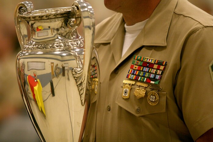 The Inter-Corps Cup is held in by a shooting team captain after being awarded during a ceremony here April 3. The trophy represents the team shooting the top score during the 2009 Eastern Division Match Championship. (U.S. Marine Corps photo by Cpl. Brian Lewis)(Unreleased)