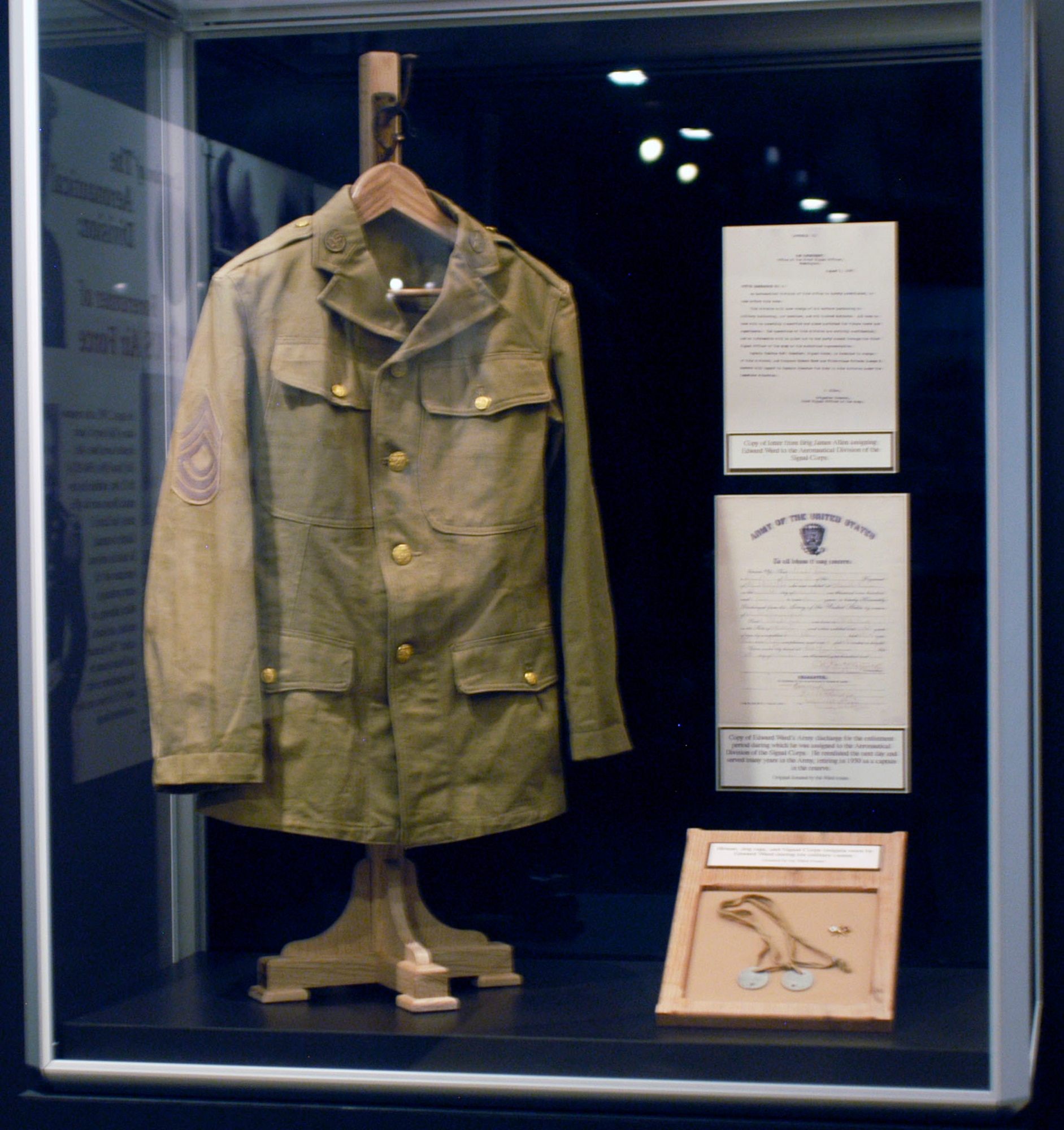 DAYTON, Ohio -- This blouse, on display in the Early Years Gallery, was worn by Edward Ward during his military career. Cpl. Ward was the first enlisted man to be assigned aviation duties in the Aeronautical Division of the Signal Corps. The items were donated by the Ward Family. (U.S. Air Force photo)
