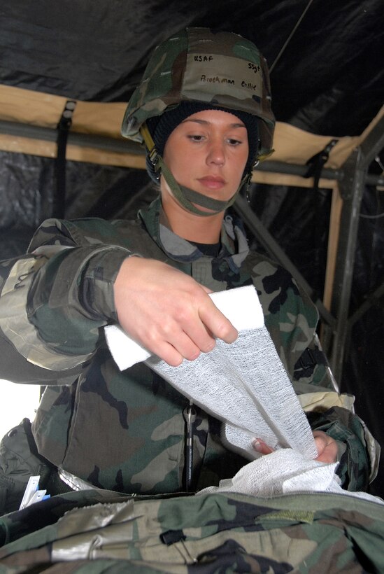 Staff Sgt. Callie Brockman of the 442nd Medical Squadron bandages an Airman simulating an injury during the March Operational Readiness Exercise. The 442nd MDS is part of the 442nd Fighter Wing, an Air Force Reserve Command A-10 Thunderbolt II unit based at Whiteman Air Force Base, Mo. (US Air Force photo/Senior Airman Dani Wolf)