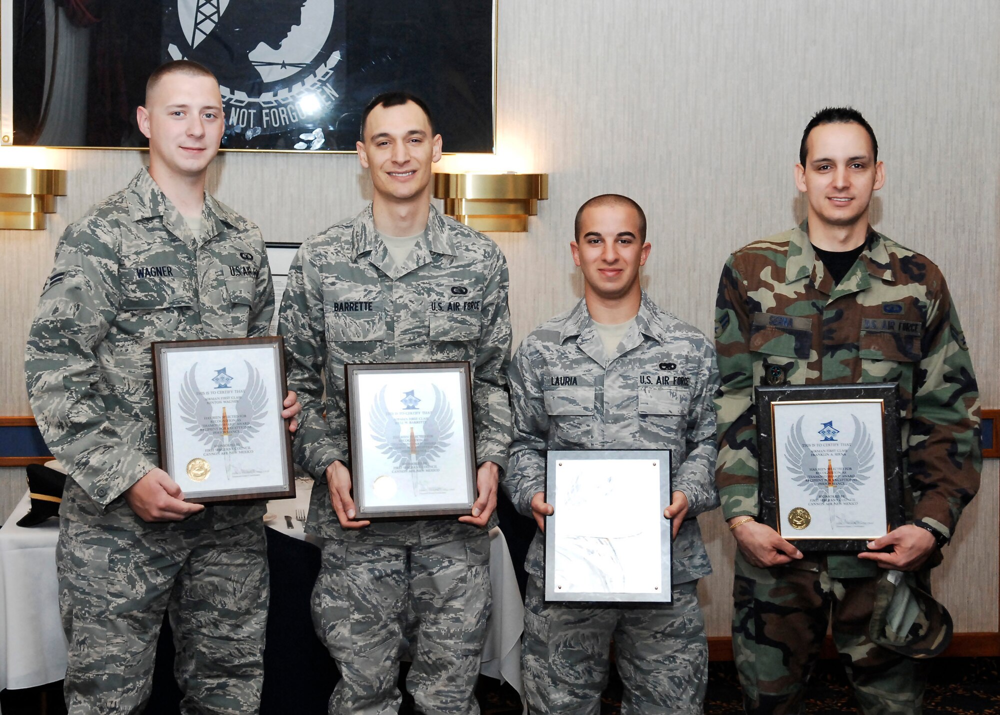 CANNON AIR FORCE BASE, N.M. -- (Left to right) Airman 1st Class Kenton Wagner, 27th Special Operations Support Squadron, Airman 1st Class Kyle Barrette, 27th Special Operations Communications Squadron, Airman Frank Lauria, 27th Special Operations Equipment Maintenance Squadron, and Airman 1st Class Frank Serna, 27th Special Operations Comptroller Squadron, display their Diamond Sharp awards at the Pecos Trail Dining Facility April 2. Diamond Sharp awards are presented monthly to Airmen who display excellence on and off duty. (Air Force photo/Airman 1st Class Danielle Martin)