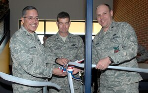 LANGLEY AIR FORCE BASE, Va. -- Colonel Michael Melendrez, 735th Supply Chain Management Group commander, Brig. Gen. Mark A. Barrett, 1st Fighter Wing commander and Lt. Col Jeffrey Ullmann, 1st Civil Engineer Squadron commander, attended the ceremonial opening of the Langley’s Logistic Support Center March 31. The center is one of the first Leadership in Energy and Environmental Design certified facilities on Langley.  Low-emitting volatile organic compounds materials were used in construction of the building.  (U.S. Air Force Photo/Senior Airman Cecil C. McCloud) 