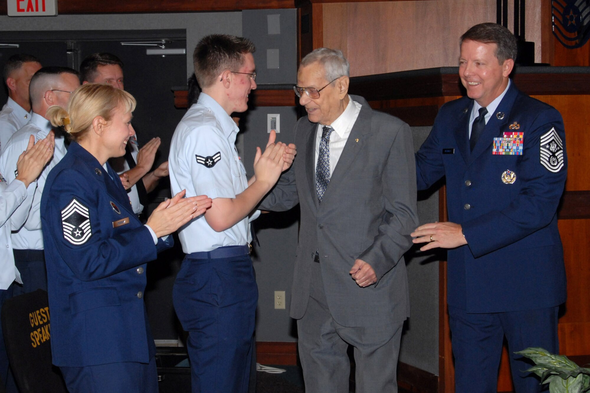 Chief Master Sgt. of the Air Force Paul W. Airey greets Airman 1st Class Matthew Shaffer and Chief Master Sgt. Pamela Derrow following a presentation in 2008. Escorting Chief Airey is current Chief Master Sgt. of the Air Force Rodney J. McKinley. Chief Airey passed away March 11. Chief Airey was the first chief master sergeant of the Air Force, Chief Derrow is the U.S. Air Forces in Europe command chief. (Courtesy photo) 
