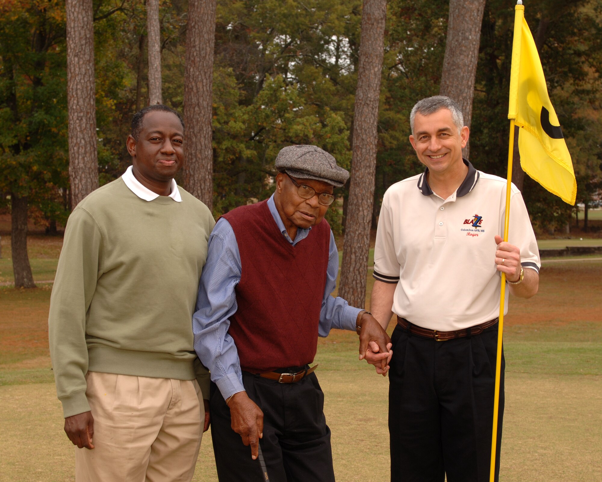 Col. Mark Brown, 14th Mission Support Group commander (left), and Col. Roger Watkins, 14th Flying Training Wing commander (right), stand with George “Happy” Irby, Sr., at the Happy Fund Annual Golf tournament on Nov. 14, 2008.  Irby passed away last Friday on his 94th birthday. (U.S. Air Force Photo/Sonic Johnson)
