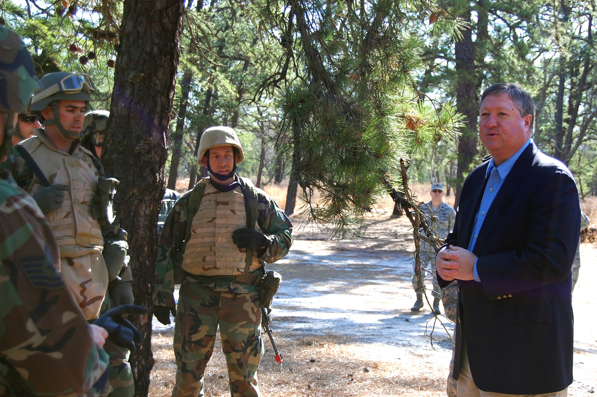Secretary of the Air Force Michael Donley visits with Airmen who are training in the Advanced Contingency Skills Training Course on March 31, 2009, on Fort Dix, N.J.  The visit was part of an overall visit by Secretary Donley to the U.S. Air Force Expeditionary Center to see its facilities and training venues.  Besides Fort Dix, Secretary Donley also visited McGuire Air Force Base and Naval Air Engineering Station Lakehurst to learn more about the Joint-Basing Initiative.   (U.S. Air Force Photo/Tech. Sgt. Scott T. Sturkol)