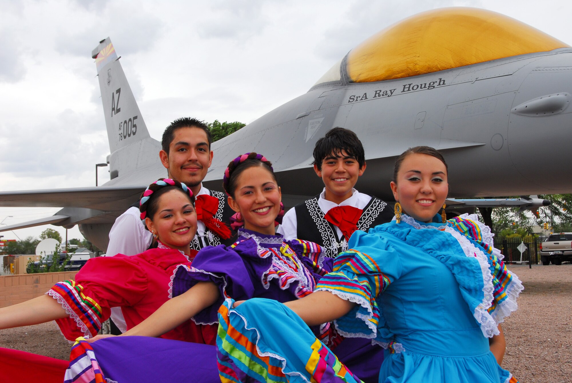 Tucson’s Ballet Folklorico Los Mextucaz, take a souvenir photo in front of an F-16 static display at the 162nd Fighter Wing at Tucson International Airport. The dance team demonstrated Mexican folk dancing at the wing to celebrate Hispanic Heritage month, Oct. 3, 2008. (Air National Guard photo by Master Sgt. Dave Neve)