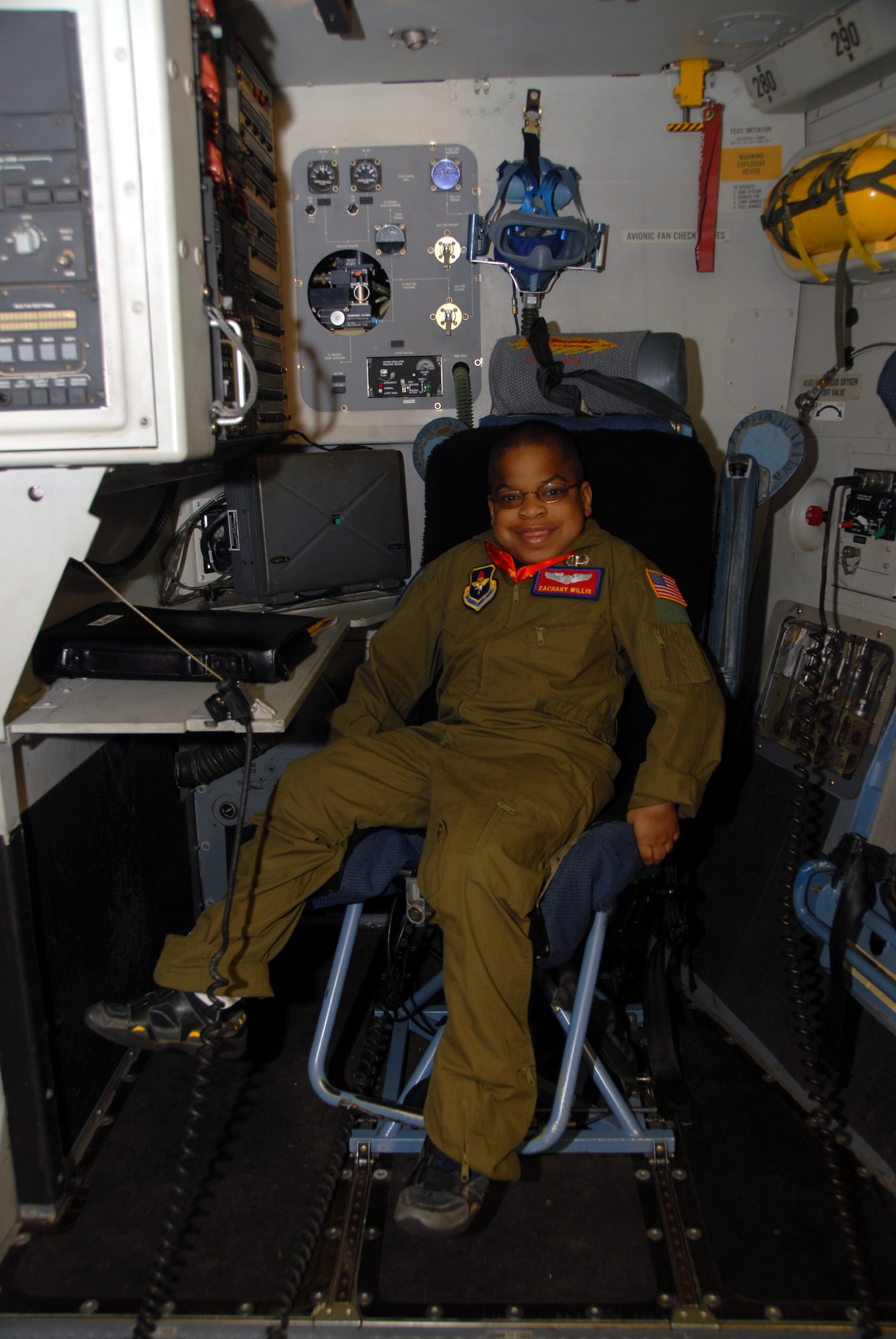 ALTUS AIR FORCE BASE, Okla. -- Zachary Willis flashes a smile while sitting in a C-17 static display during the "Pilot for a Day" event March 20. (U.S. Air Force photo/Senior Airman Jennifer L. Flores)