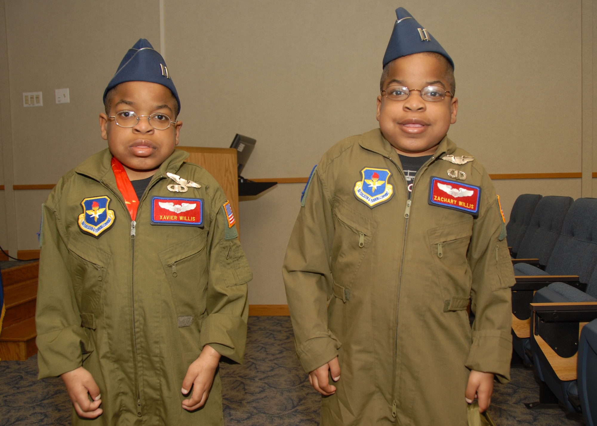 ALTUS AIR FORCE BASE, Okla. -- Xavier and Zachary Willis display their pilot wings during the "Pilot for a Day" event here March 20. The event lets severely ill children experience a day in the life of an Air Force pilot. (U.S. Air Force photo/Senior Airman Jennifer L. Flores)