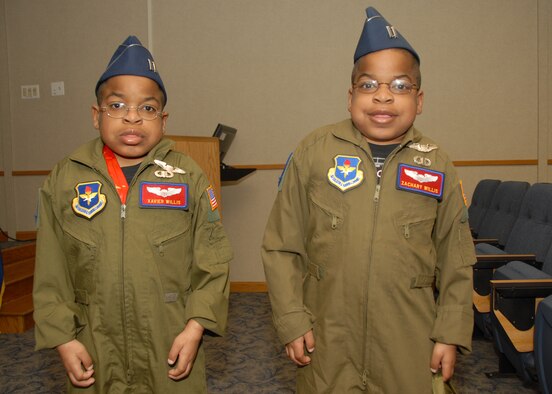 ALTUS AIR FORCE BASE, Okla. -- Xavier and Zachary Willis display their pilot wings during the "Pilot for a Day" event here March 20. The event lets severely ill children experience a day in the life of an Air Force pilot. (U.S. Air Force photo/Senior Airman Jennifer L. Flores)