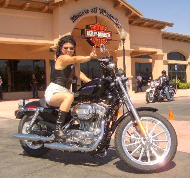 National Full-Scale Aerodynamcis Complex’s Ana Chaverri poses for a photo on her new Harley Davidson Sportster 883 motorcycle in front of the House of Thunder Harley Davidson dealership south of San Jose. (Photo provided)