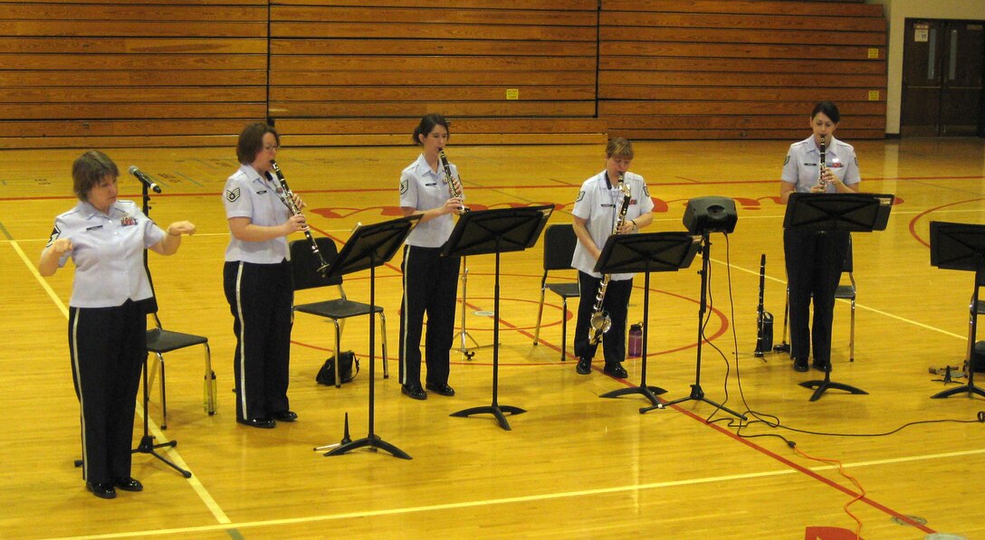 Master Sgt. Allison Baugh of the New Horizons clarinet ensemble adds diversity to the group's performance by putting sign language to the music.  This performance was part of group's educational outreach concerts in Yutan and Elkhorn, NE as part of Music In Our Schools Month.  New Horizons is part of the USAF Heartland of America Band.  