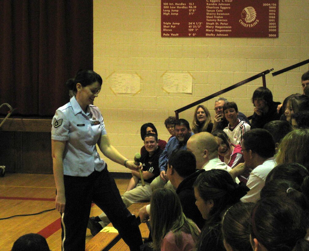 Staff Sgt. Crystal Proper of the New Horizons clarinet ensemble interacts with students during the group's educational outreach concerts in Yutan and Elkhorn, NE as part of Music In Our Schools Month.  New Horizons is part of the USAF Heartland of America Band.  