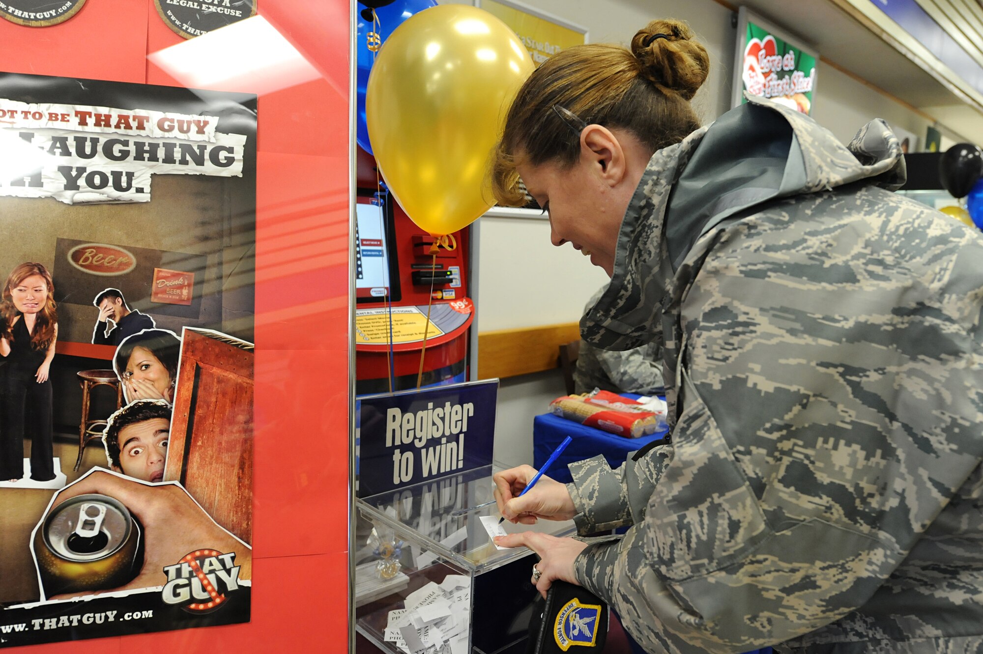 MINOT AIR FORCE BASE, N.D. – Tech. Sgt. Michelle Wells, a 91st Missile Security Forces Squadron flight chief, registers to win prizes during a National Alcohol Screening Day event at the base exchange here April 2. By completing this alcohol self-assessment, Airmen can potentially prevent unhealthy drinking habits before they start.  (U.S. Air Force photo by Senior Airman Kelly Timney)