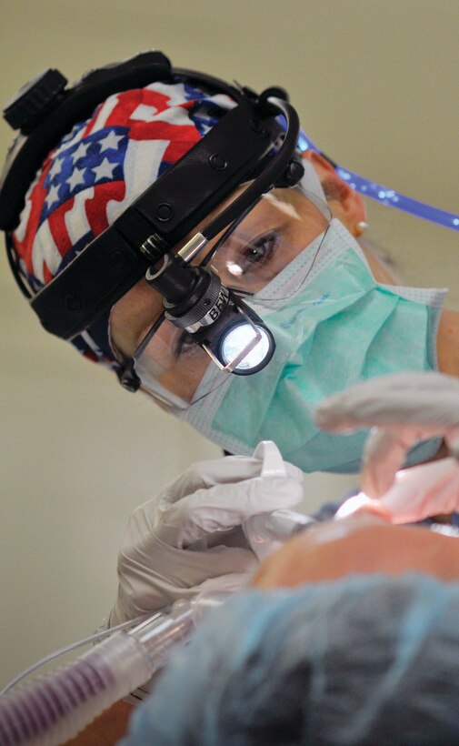 Dr. Eileen Dauer, 779th Surgical Operations Squadron, performs a septorhinoplasty and inferior turbinate reduction at Malcolm Grow Medical Center. This procedure will help her patient breathe better through his nose and improve his quality of sleep. Dr. Dauer is a Otolaryngologist (Ears Nose and Throat Clinic) MGMC. National Doctor's Day is March 30th. (U.S. Air Force photo/ Tech. Sgt. Suzanne Day)