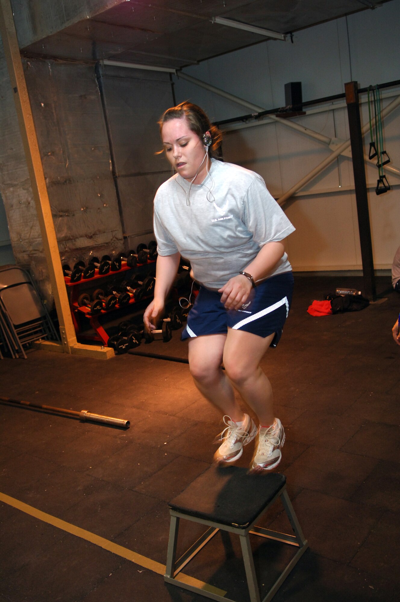 JOINT BASE BALAD, Iraq ? Senior Airman Tiffany Trojca, 332nd Air Expeditionary Wing public affairs photographer, performs a box jump during a CrossFit class here March 9. CrossFit is a strength and conditioning program offered at the Red Tail Fitness Center here. Airman Trojca is deployed here from Holloman Air Force Base, N.M., and is a native of Clawson, Mich. (U.S. Air Force photo/Staff Sgt. Dilia Ayala)